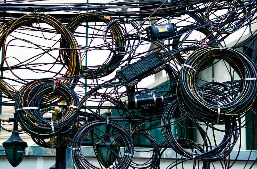 Tangled messy cables and wires showing poor cable management