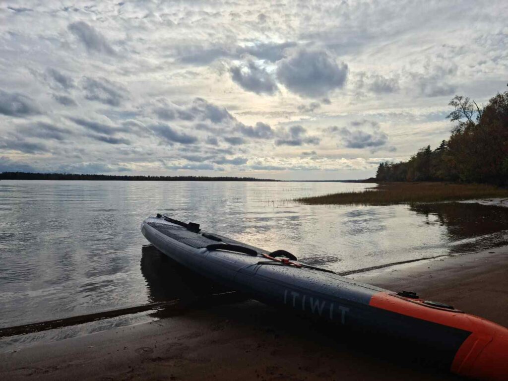 inflatable kayak on shore ready for inflation pressure check