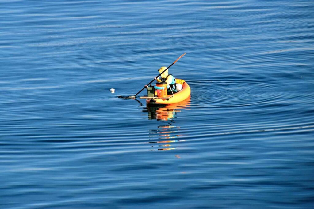 solo kayaker on calm water with balanced kayak setup