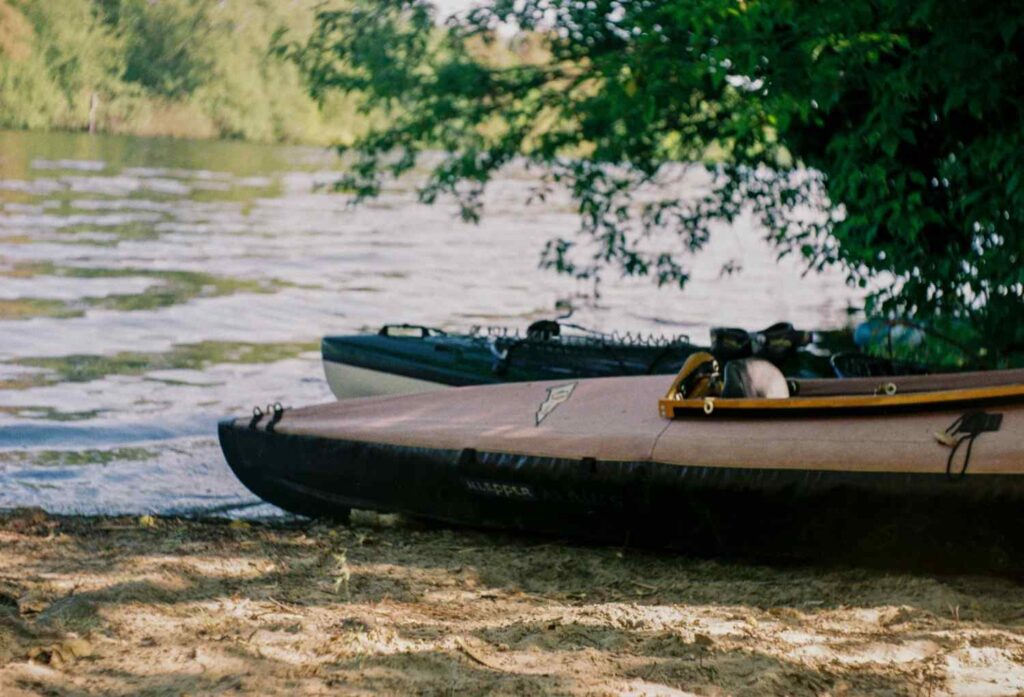kayak on river bank shore entry point calm water