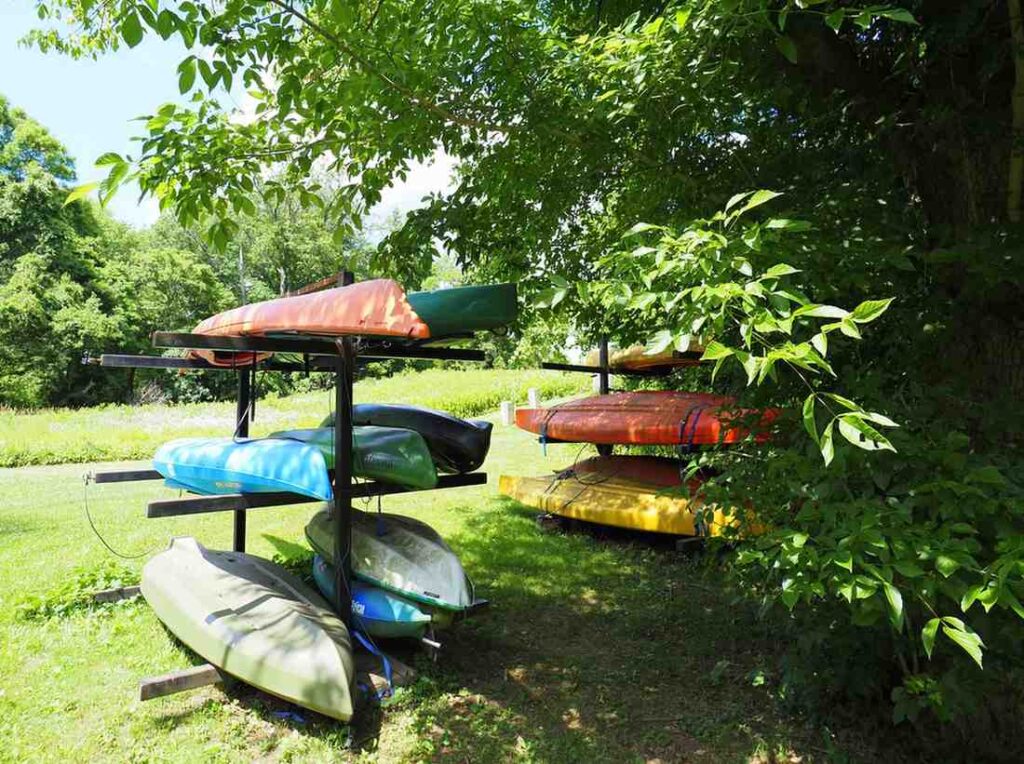 Various colorful kayaks of different sizes=